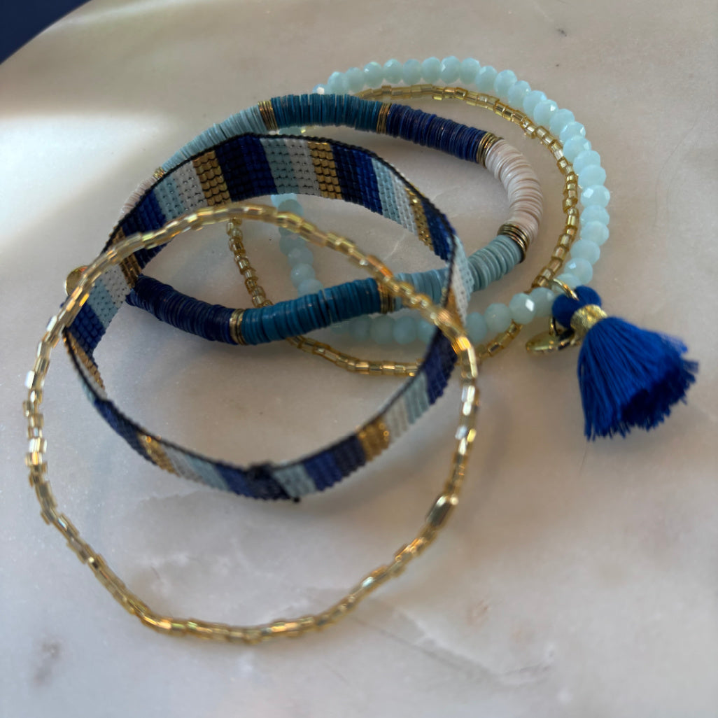 Bracelet stack in blue and gold